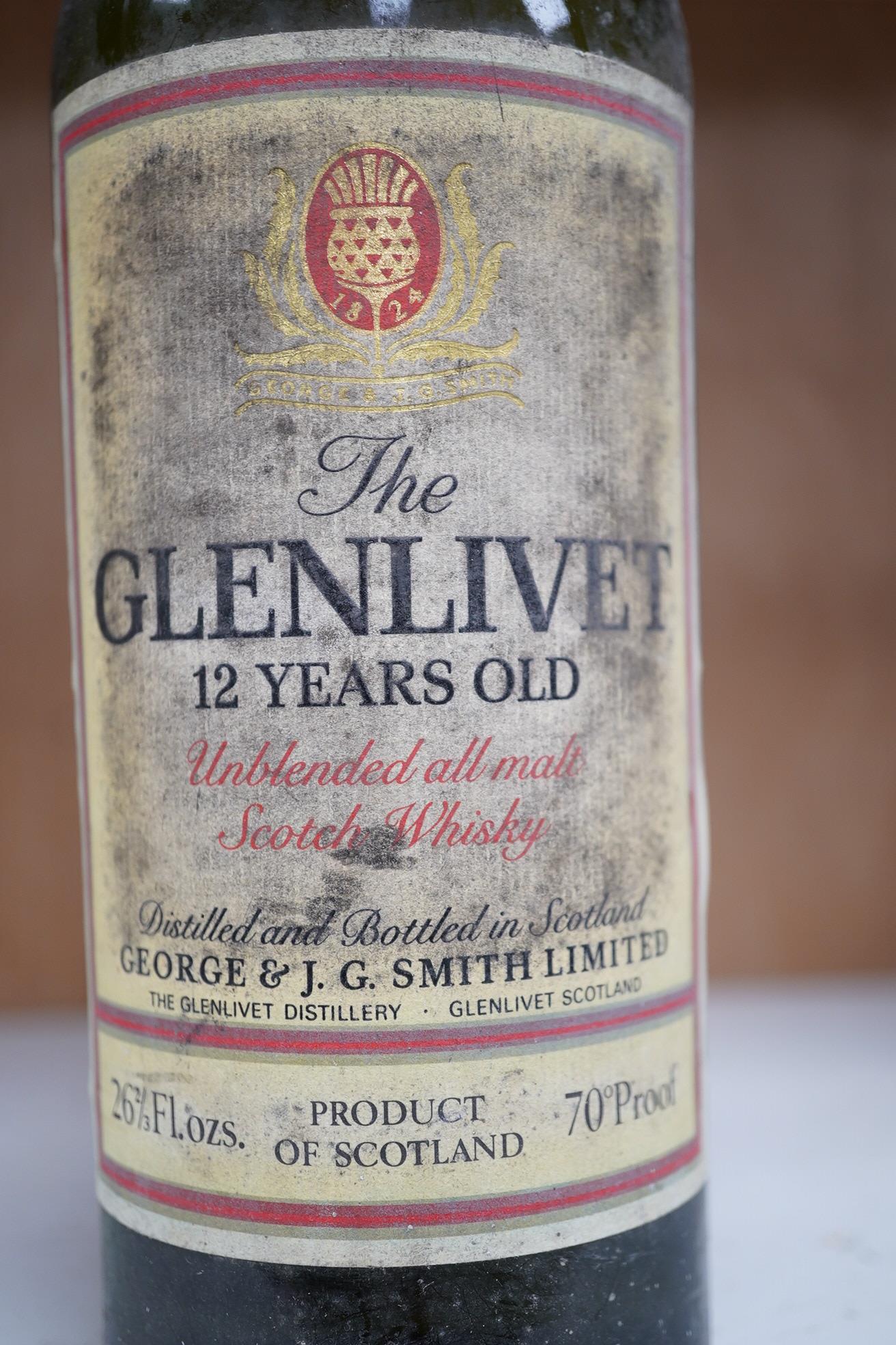 A vintage bottle of The Glenlivet 12 year old single malt whisky, 26 2/3 Fl oz. Condition - fair to good, storage unknown